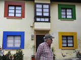 Man in front of decorated house