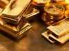 Gold futures drop Rs 219 on weak global cues