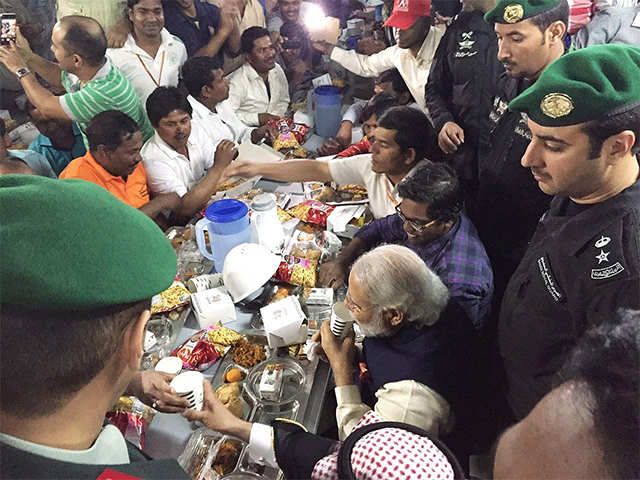 PM Modi shares snack with Indian workers in Riyadh