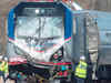 Amtrak train hits equipment on track; 2 workers die