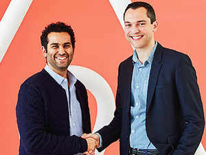 partnership handshake between Airbnb and Times Group