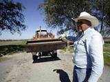 Farmer prepares to work