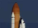 Space shuttle Atlantis lifts off from launch pad