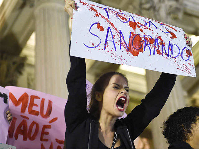 ​Brazilians protest against a gang-rape of a 16-year-old girl