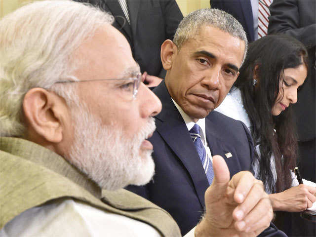 Prez Obama listens to PM Modi during press briefing