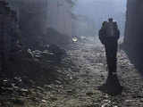 A Tibetan man carries drinking water