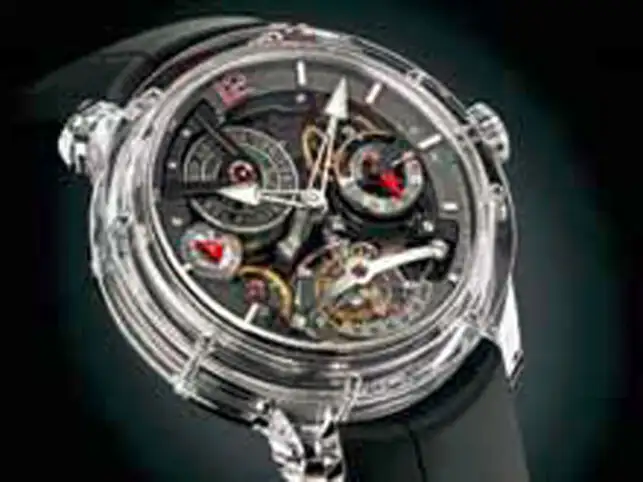 No metal is used at all in the creation of the dial and case, allowing for a panoptic view of as much of the movement architecture as possible. No metal is used at all in the creation of the dial and case, allowing for a panoptic view of as much of the movement architecture as possible.