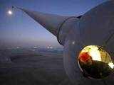 Power-generating windmill turbine in a wind farm in France