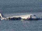 Passengers stand on the wings of a US Airways plane