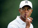 Tiger Woods gestures to a fan to be quiet