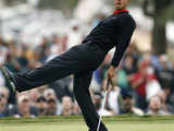 Tiger Woods reacts to a missed eagle putt