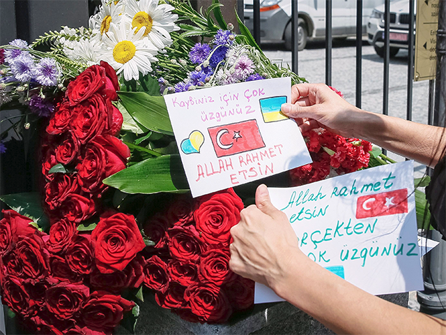 Woman lays tribute cards