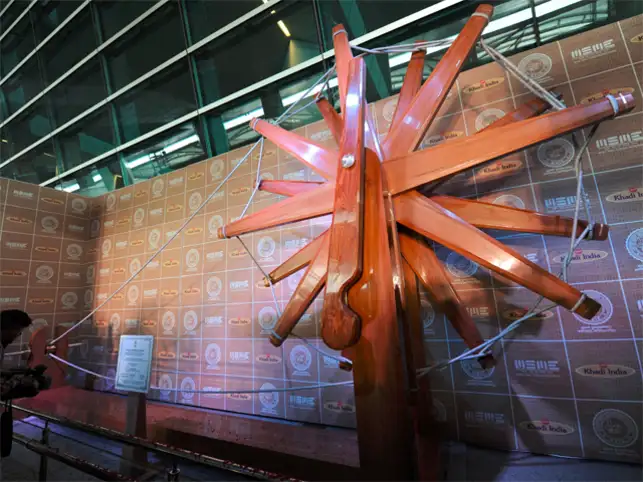 The four-tonne charkha is made of high-quality Burma teak wood, is nine feet wide, 17 feet tall and 30 feet long. The four-tonne charkha is made of high-quality Burma teak wood, is nine feet wide, 17 feet tall and 30 feet long.