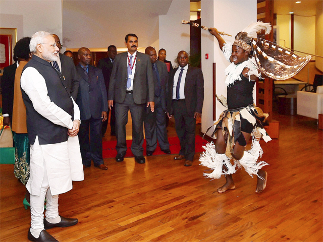 A traditional dancer performs before PM Modi