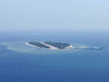 China tests two new airports in disputed South China Sea islands