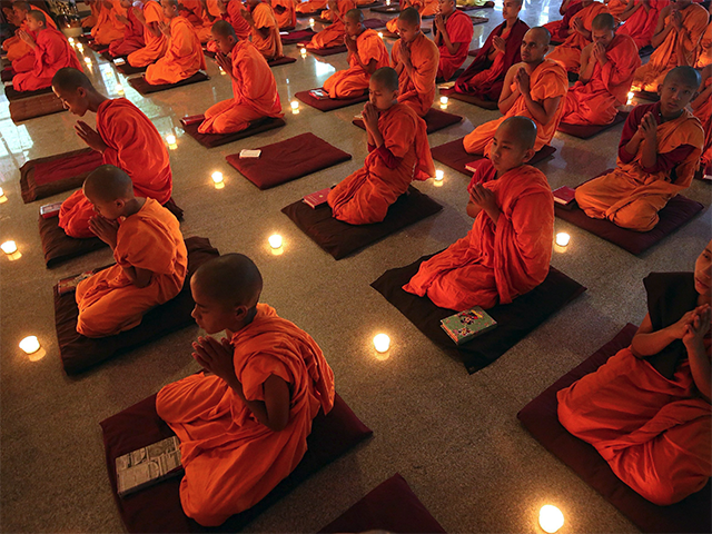 Tibetan Buddhist monks attend Guru Purnima prayer