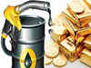 Crude prices trade flat, strong dollar weighs on gold