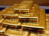 Gold slips as investors await central bank decisions