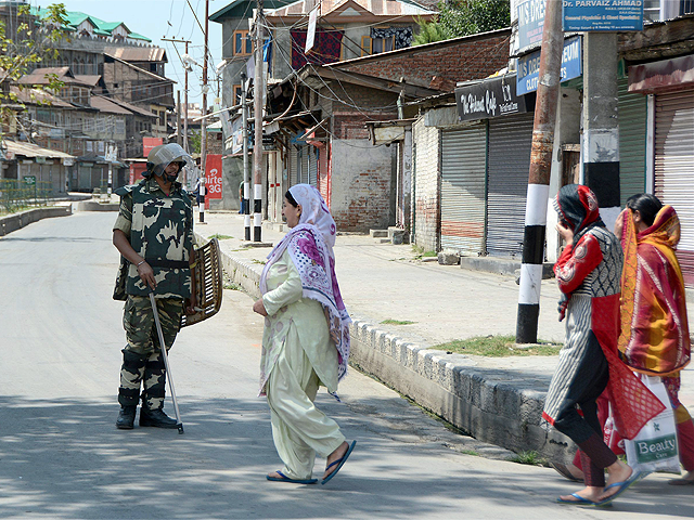 Women seek permission from security personnel