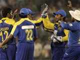 Sri Lankan players celebrate the dismissal of Sehwag