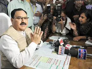 Ink was thrown at the Minister at the entrance of the AIIMS when he was in his car leaving the institute, surrounded by protesting students amid and rains and chaos. Ink was thrown at the Minister at the entrance of the AIIMS when he was in his car leaving the institute, surrounded by protesting students amid and rains and chaos.
