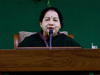 Jayalalithaa's photo watches over ministers review meetings