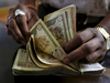 Rupee wobbles on resurgent dollar, falls 17 paise to 66.88