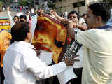 Shiv Sena activists burn posters