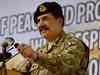 Banners exhort Pakistan army chief to contest polls