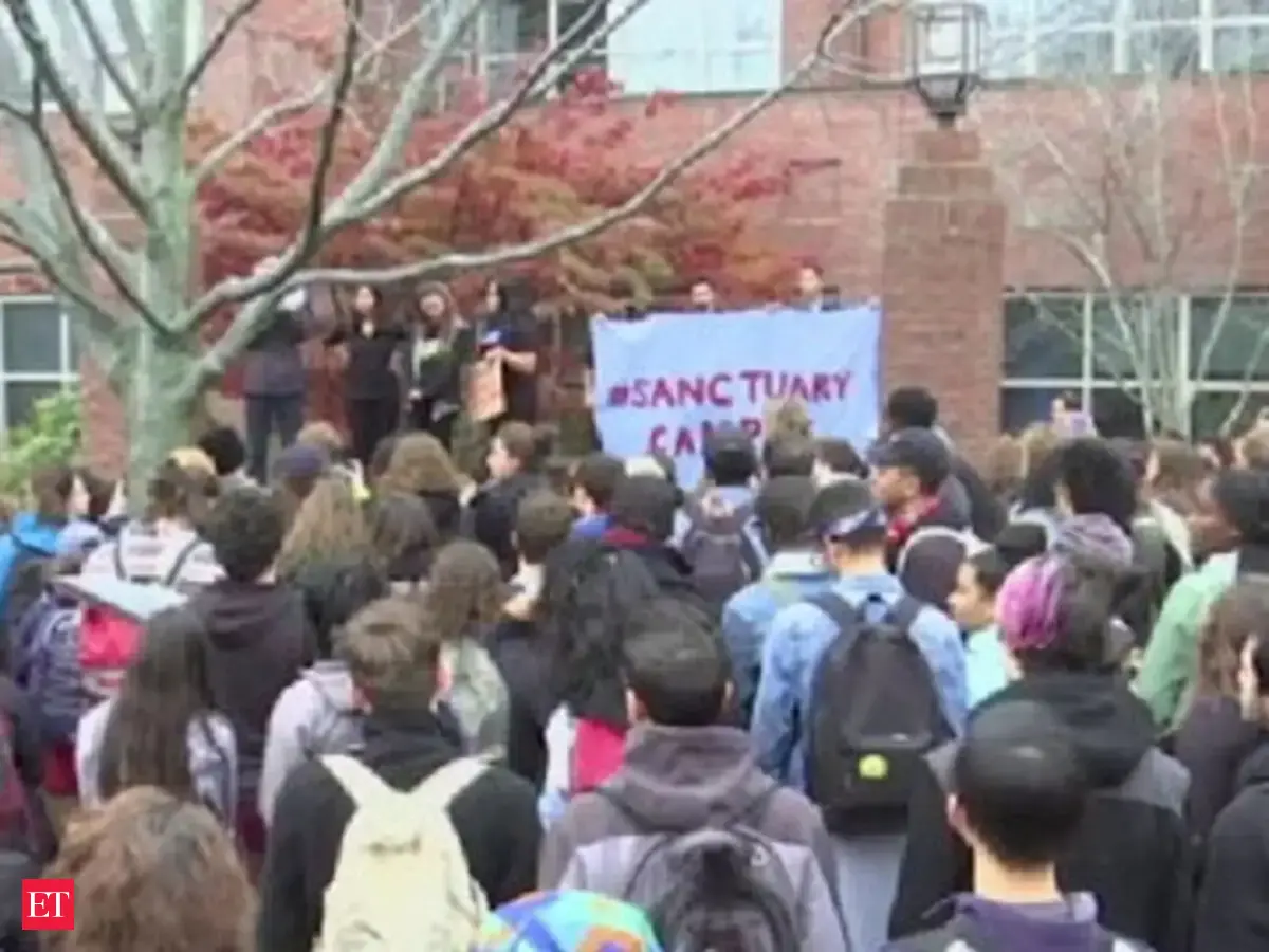 Students protest Trump's deportation plans - The Economic Times Video ...