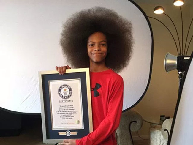 Guinness World Record 13 Year Old Boy With World S Largest Afro Measuring 25 4 Cms The Economic Times