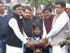 UP CM Akhilesh Yadav distributes tricycles to specially-abled children
