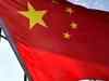 Heralding social, financial change, China aims blow at iron rice bowl