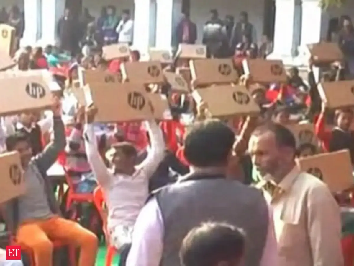 Akhilesh government distributes free laptops to students - The Economic ...