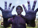 Boy covered with coloured powder 