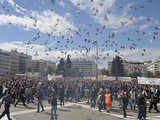 Demonstrators escape the tear gas