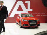 Audi CEO Rupert Stadler walks past an Audi A1