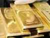 Gold prices firm up, crude oil slips below $82