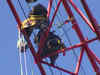 Protesters climb a construction crane in Washington