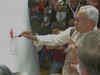 Nitish Kumar fills colours in lotus painting, triggers debate