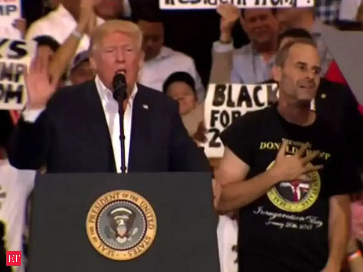 Supporter joins Trump on Florida rally stage - The Economic Times Video ...