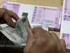 Rupee firms up by 2 paise to 66.69 against dollar