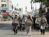 Security personnel patrol streets