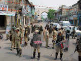 Security personnel patrol streets