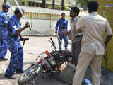 Security personnel charging man violating the curfew orders