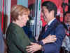 Angela Merkel joins hands with Shinzo Abe to defend free trade