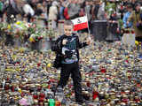 Child walking with candles in front of Presidential Palace in Warsaw