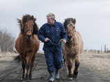 Ingi Sveinbjoernsso leads his horses