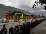 Bhutanese school girls wait to greet dignitaries