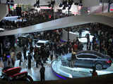 Visitors surround latest models of cars